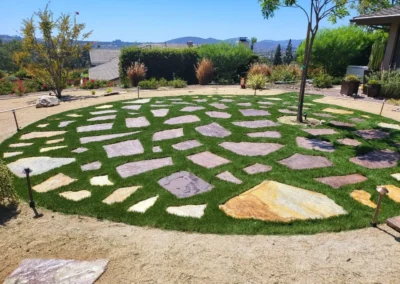 a circular pattern of grass and rocks