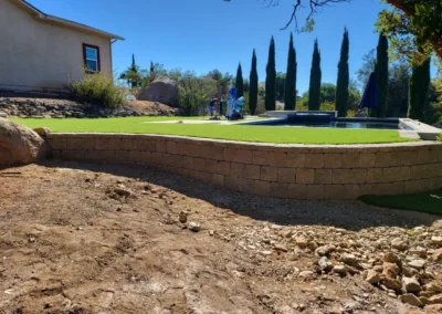 a house with a pool and grass